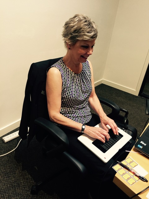 Photo: Jane with her light speed steno machine