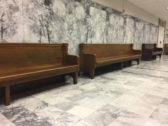 Photo: Sitting in the hall of the 7th floor of King County Superior Court .