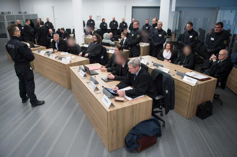 Defendants of the the far-right group "Gruppe Freital" wait for their verdict in a courtroom in Dresden, Germany, March 7, 2018. © 2018 Reuters