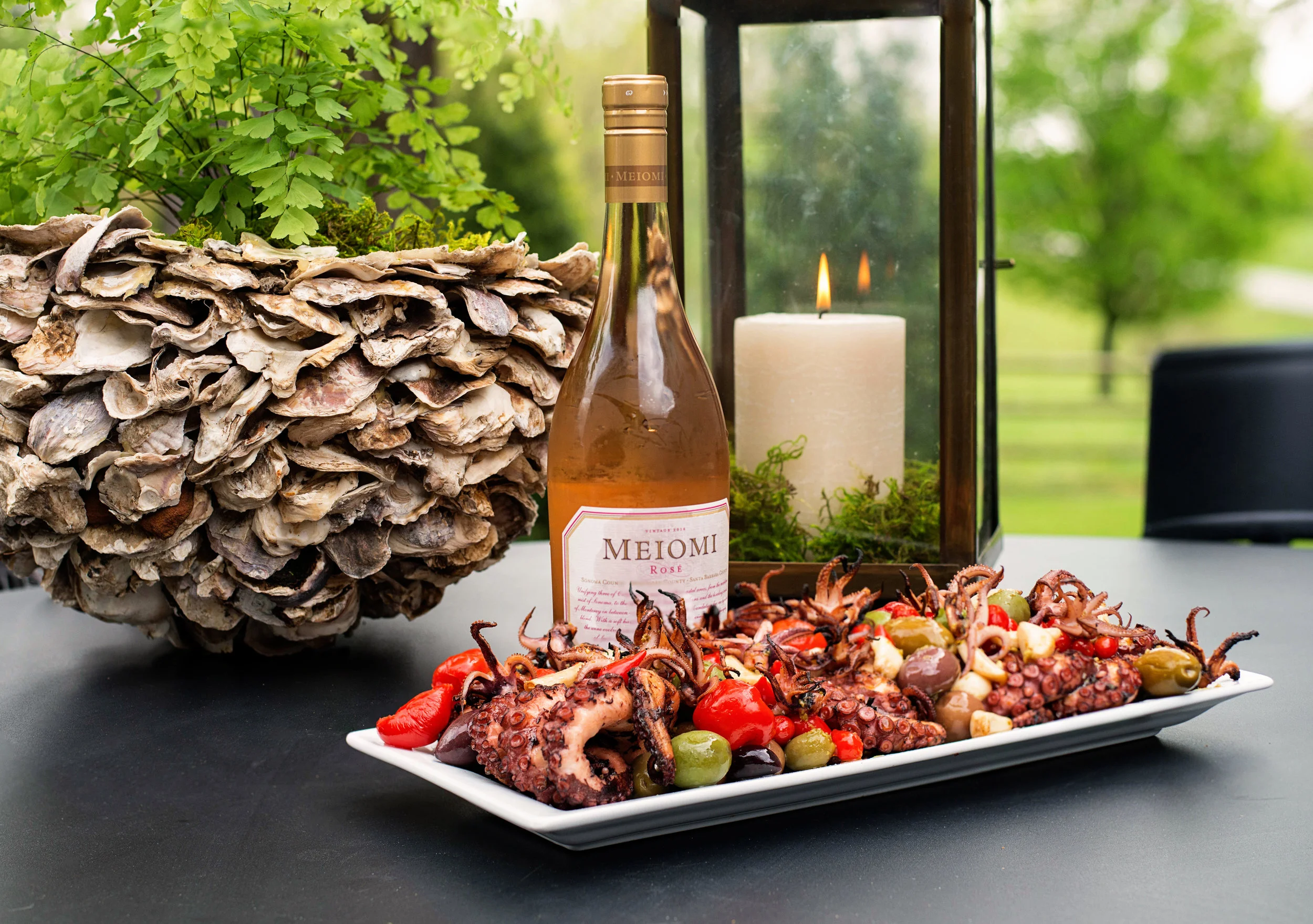 Let's Get KRAKEN on this Charred Baby Octopus with Olives, Pickled Peppers, and Basil Oil