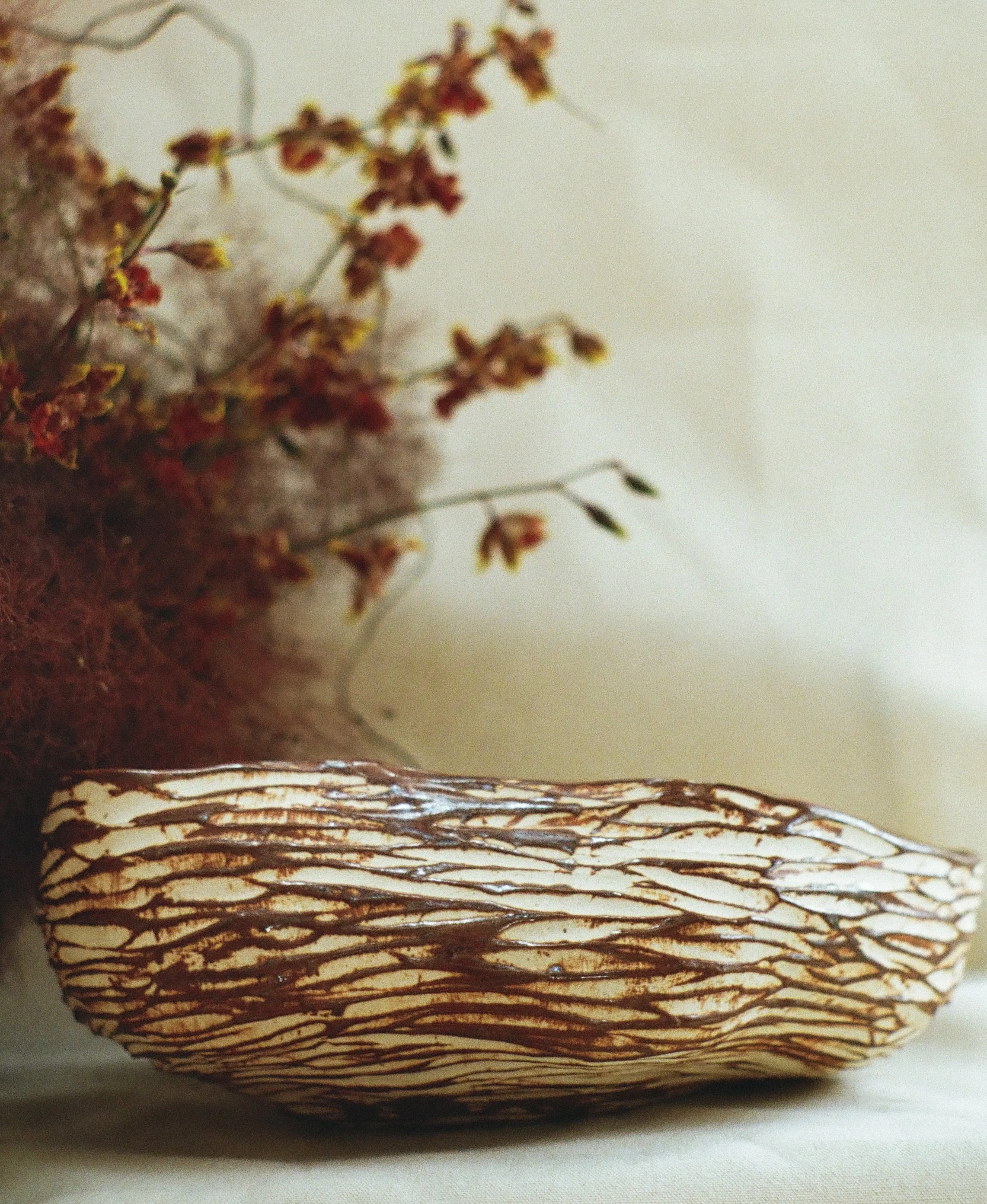 Rhythmic texture and warm colors make this a welcoming piece for your living space

#losangelesartist #ceramicartist #homedecorstartup #homedecorsmallbusiness #ceramicvase
