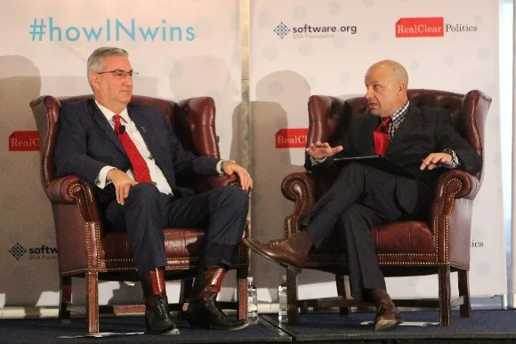 Tom Bevan (right) interviews Indiana Governor Eric Holcomb | Photo via thestatehousefile.com