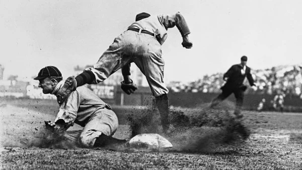 Ty Cobb sliding into third base , 1910.