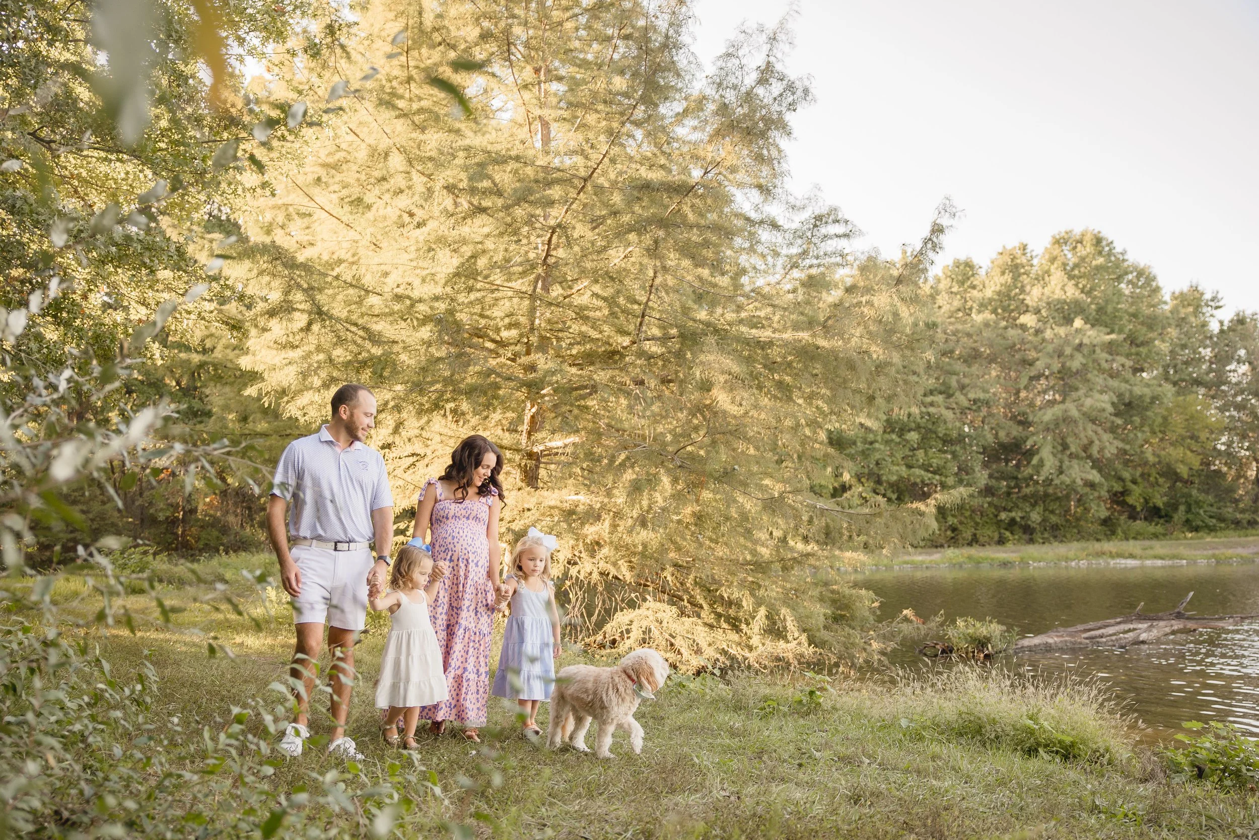 Family photographed at James A. Reed Memorial Wildlife Area during a light-filled Kansas City outdoor family session.