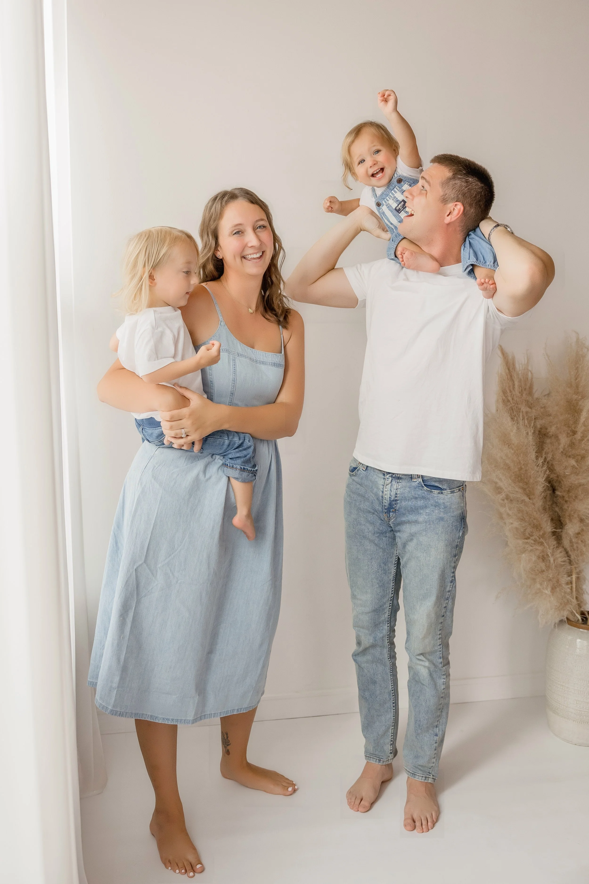 A quiet, happy moment between parents and their boys.jpg