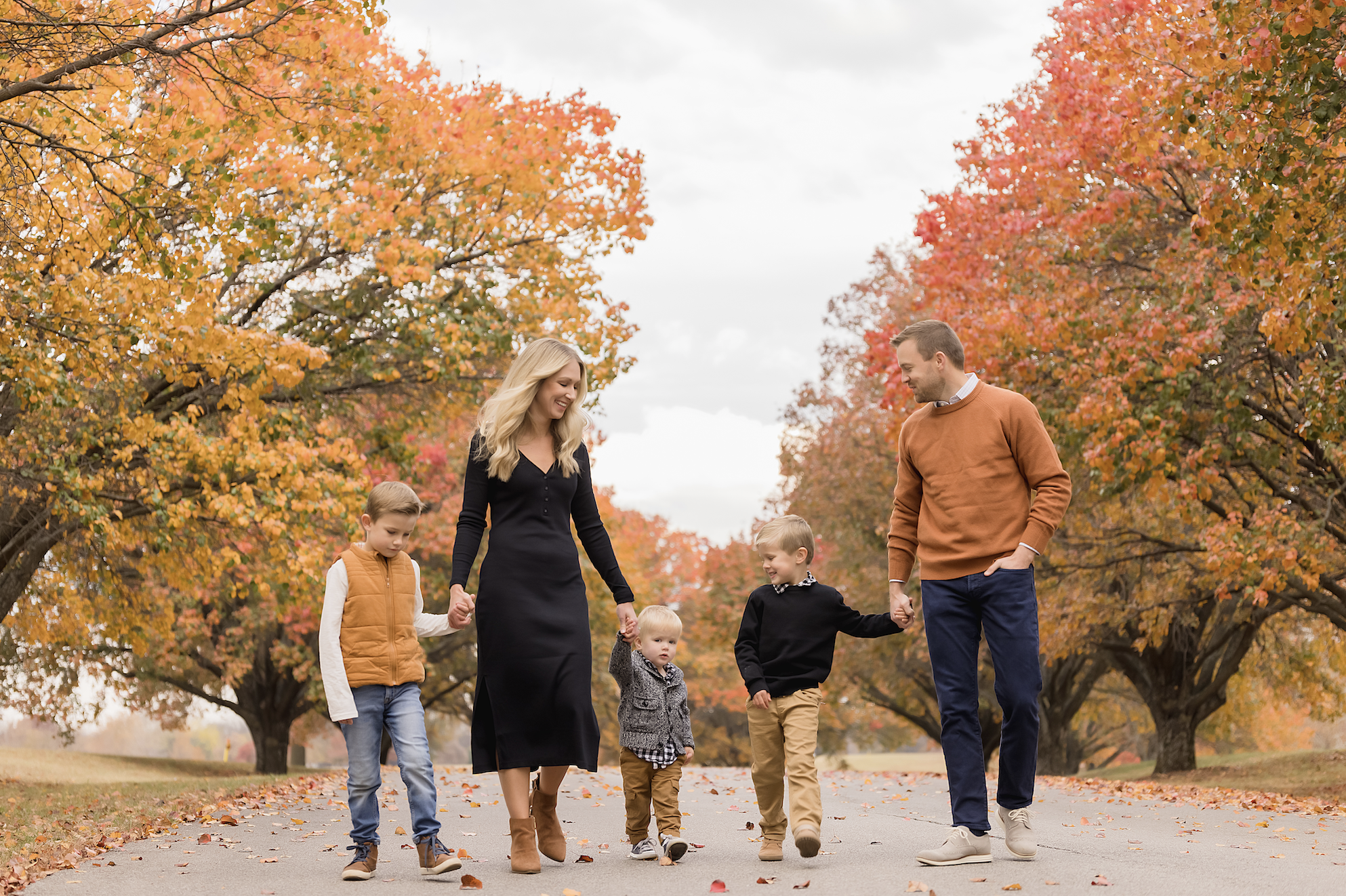 Fall family photography session at Loose Park in Kansas City with vibrant autumn colors.