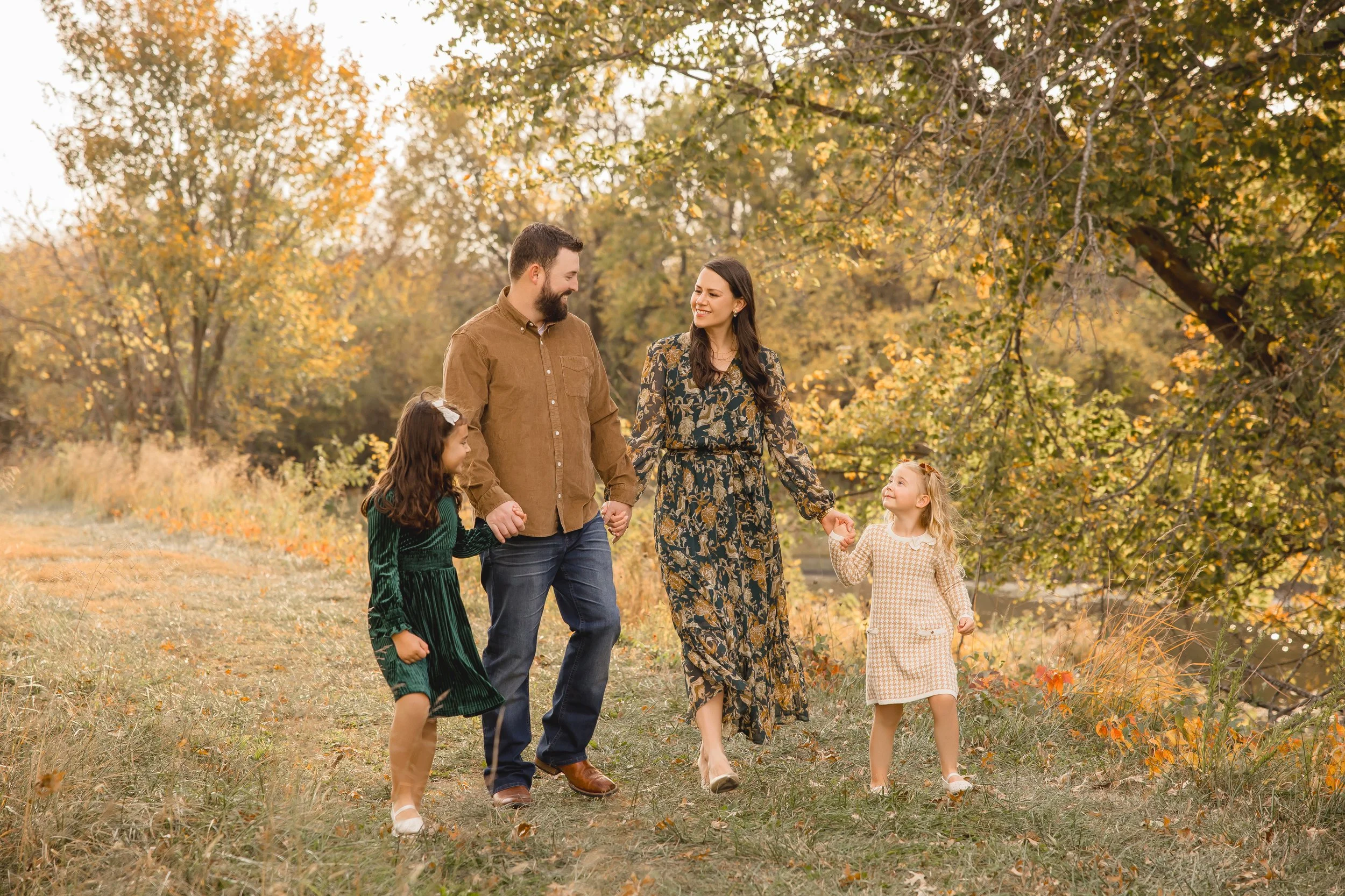 Extended family photography session in Kansas City featuring multiple generations outdoors in fall.