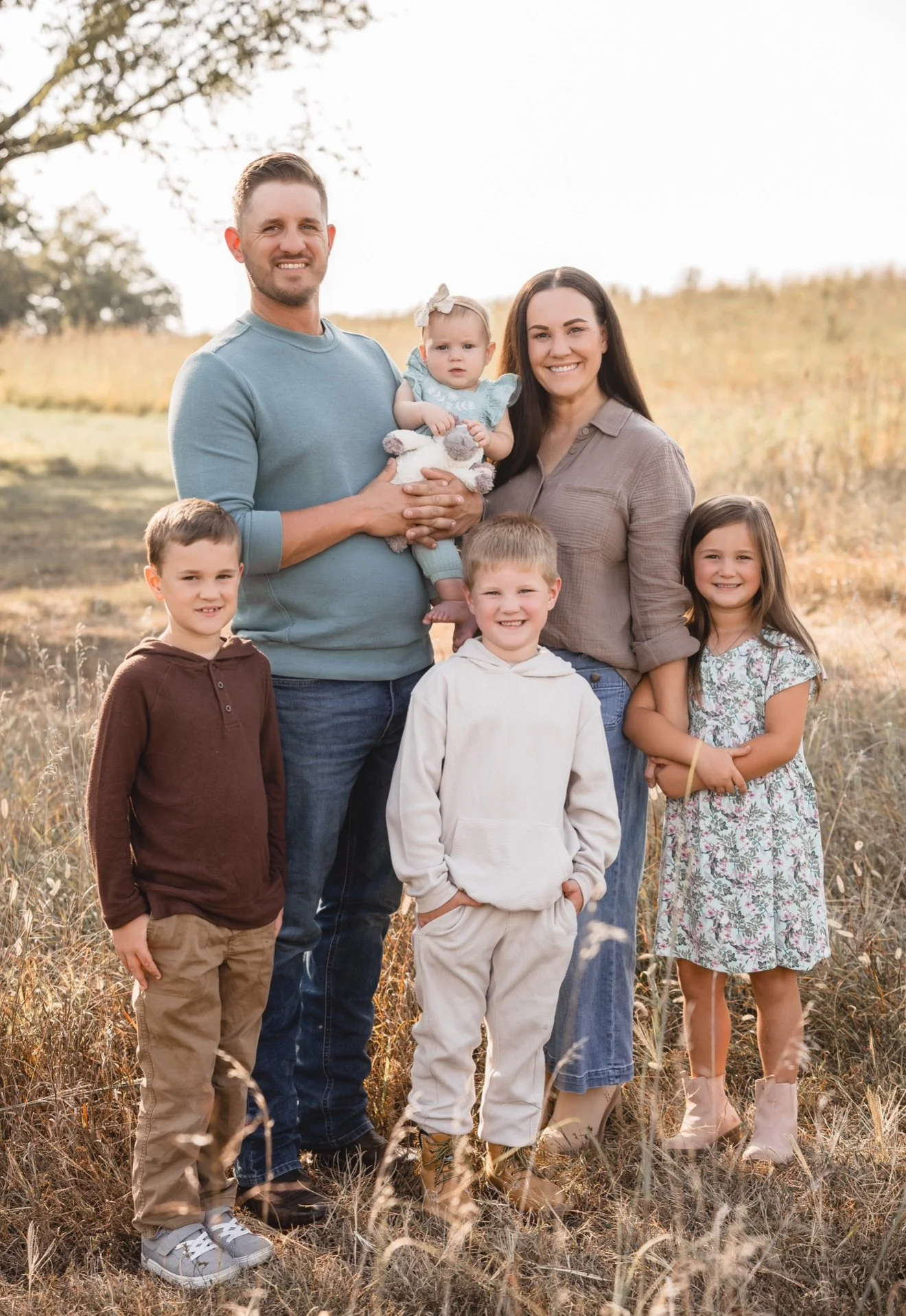 Classic family session photographed in Kansas City featuring immediate family outdoor portraits.