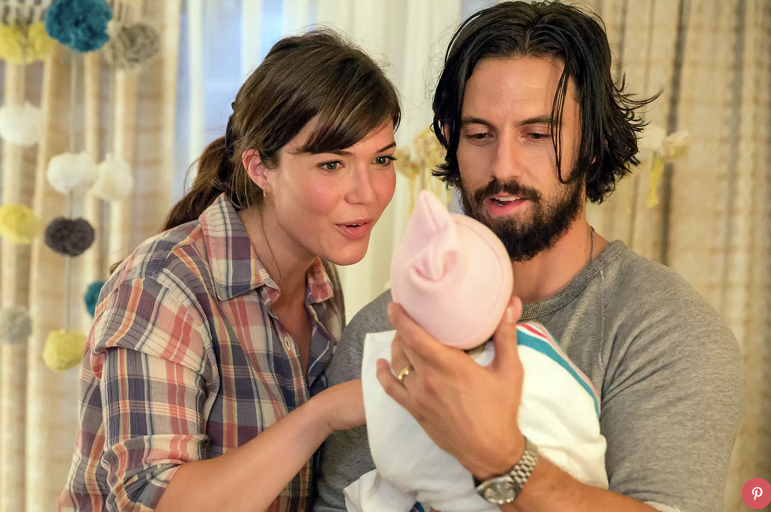 This is how I assumed Michelle and Luke looked when they got to see their baby...they looked exactly like Mandy Moore and Milo Ventimiglia in the show This is Us.