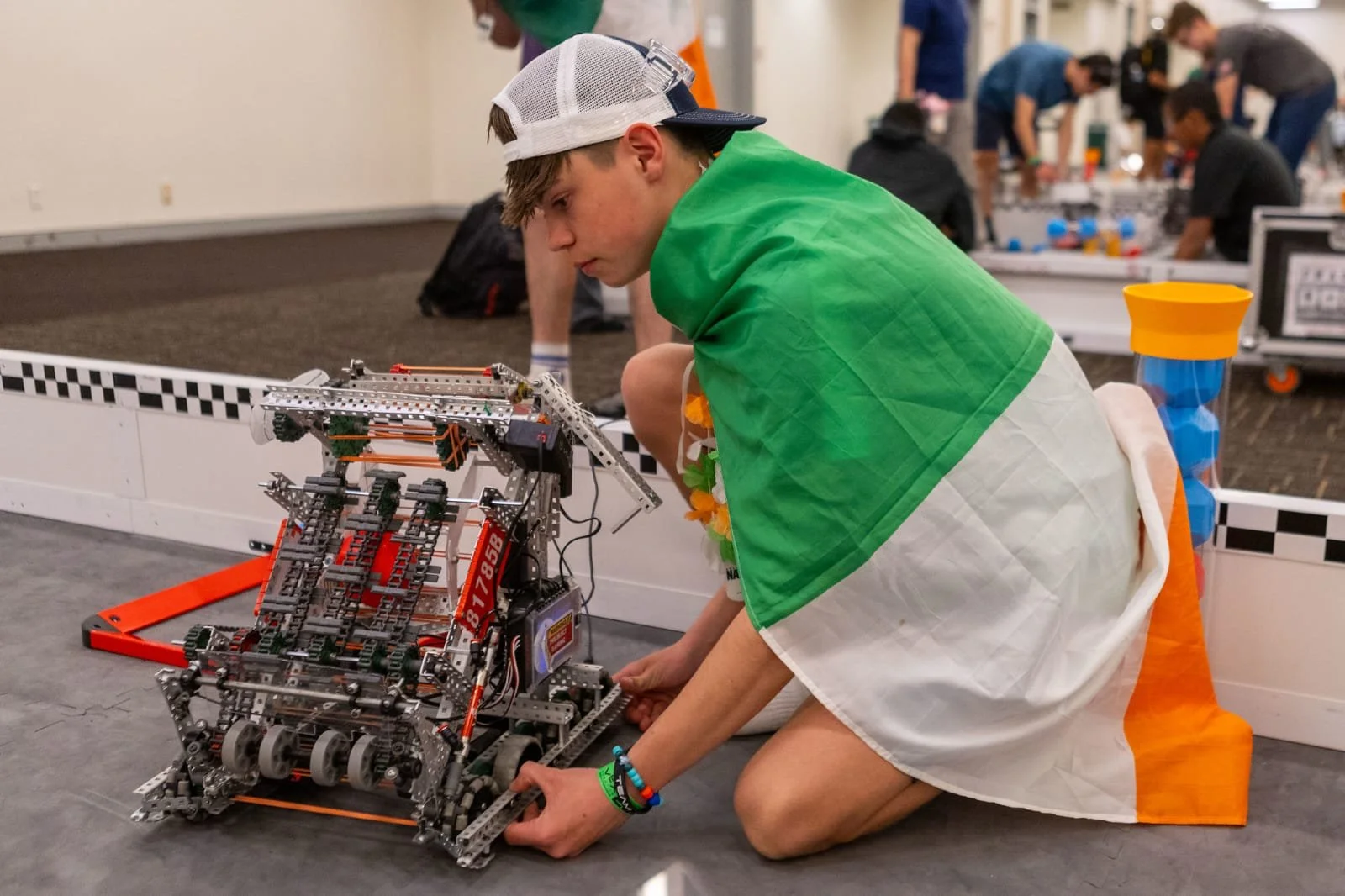 Oscar Green aligning thier robot T-VEX to run an autonmous.jpeg