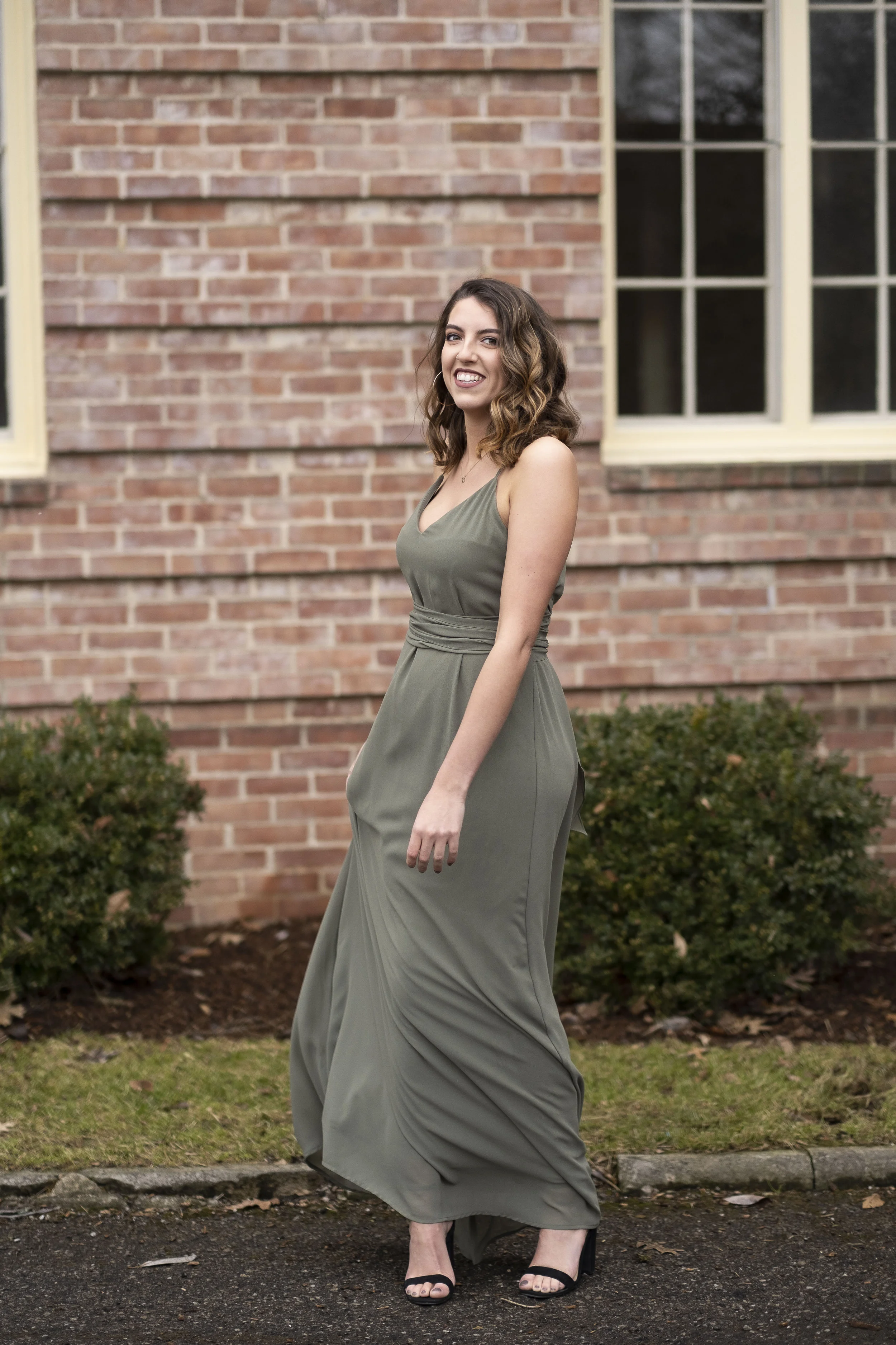 Twirling wedding guest in Nouvelle Amsale Bridesmaids Joy dress