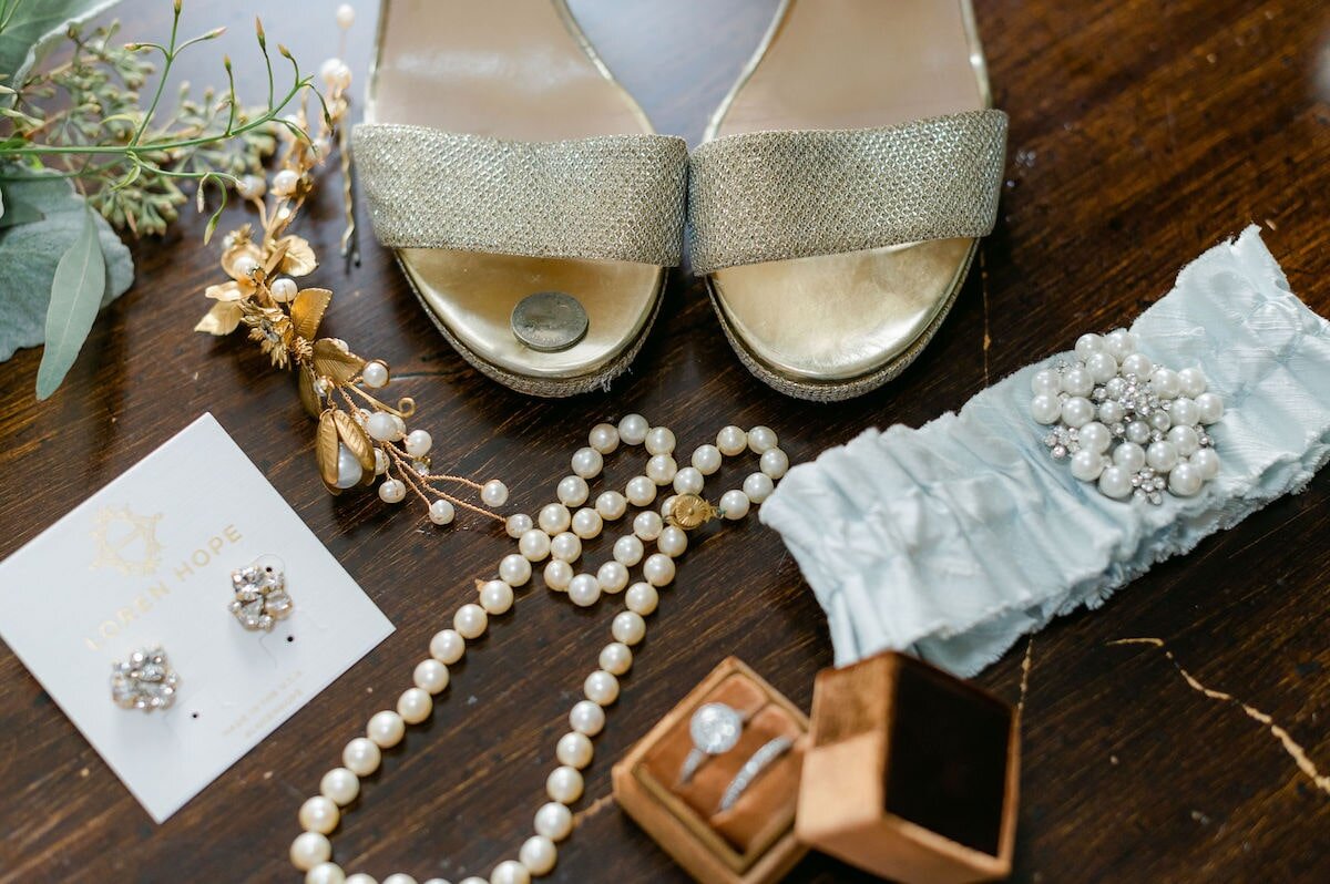 Pictured is an old (vintage) hair piece, new Loren Hope earrings, borrowed pearls, a blue La Gartier garter, and a sixpence in the shoe!