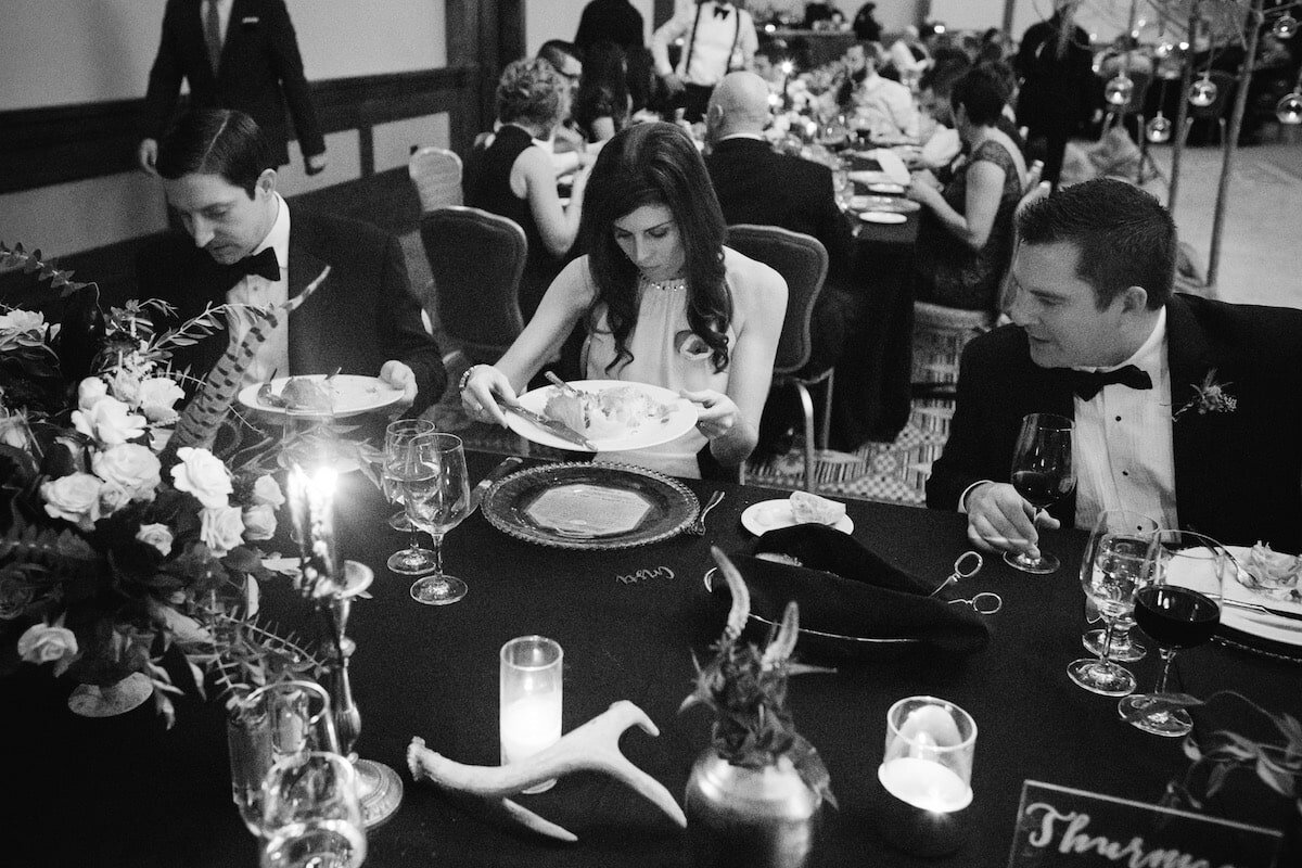 Guests revealing the stories under their plates after salads