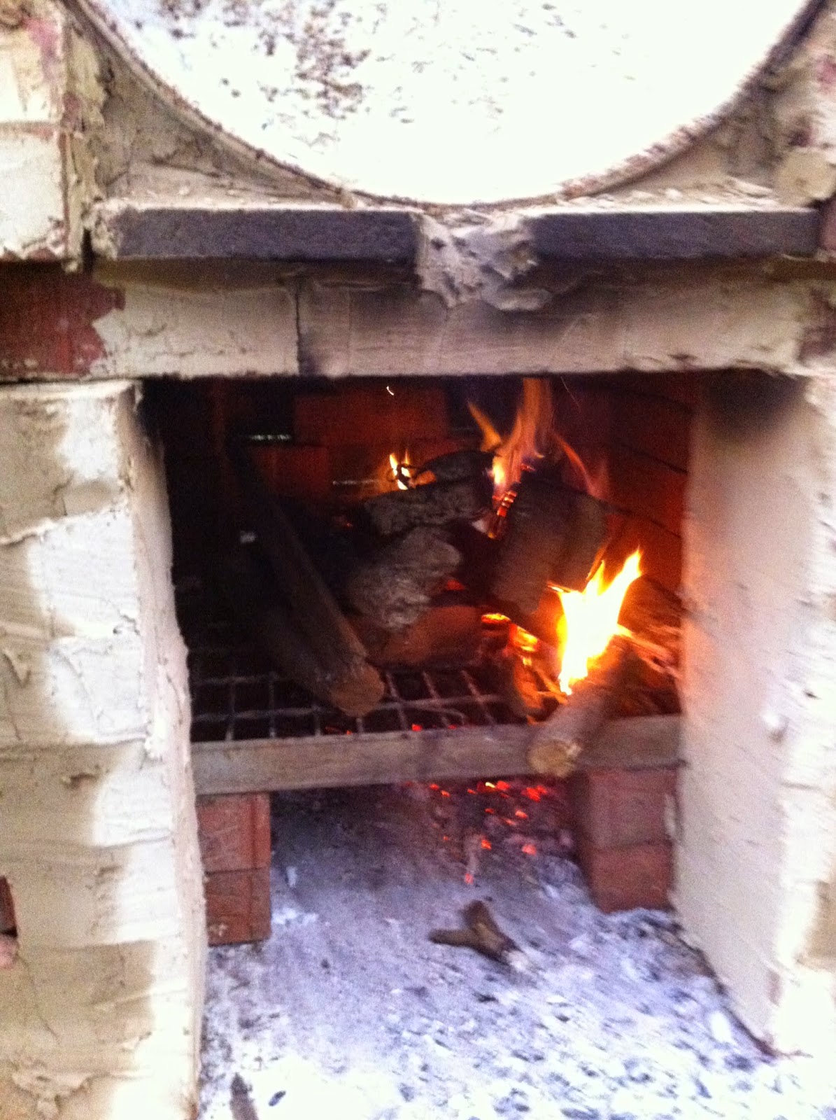 A blurry prototype Barrel oven is fired up for the first time.