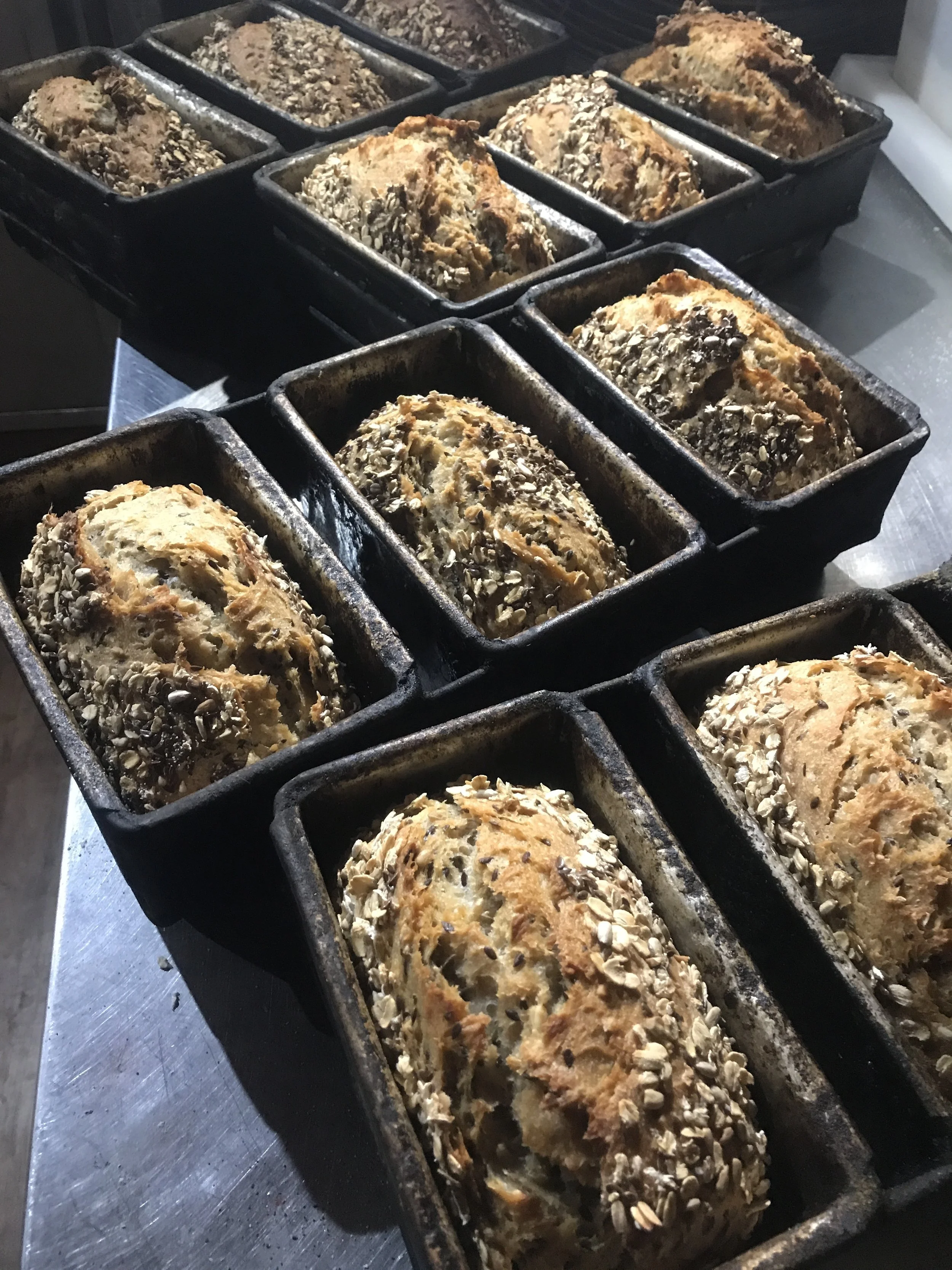 Some Seed + Grain breads transferring heat from the oven into the bench.