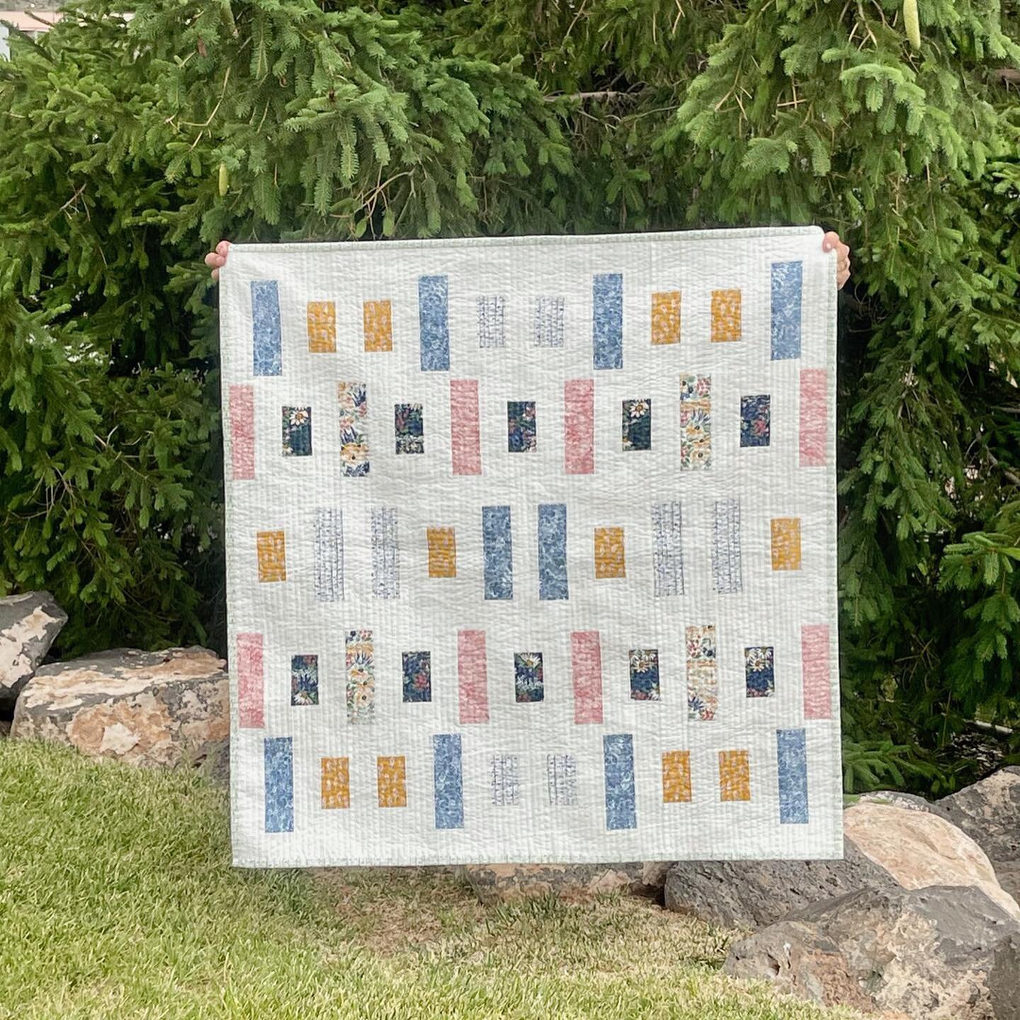 Next up in the Woven Lines tester parade are the baby sized quilts! I adore how all of these turned out! I know I will be using this pattern for future baby presents because it comes together soo quickly with not much fabric! It's a perfect scrap bus