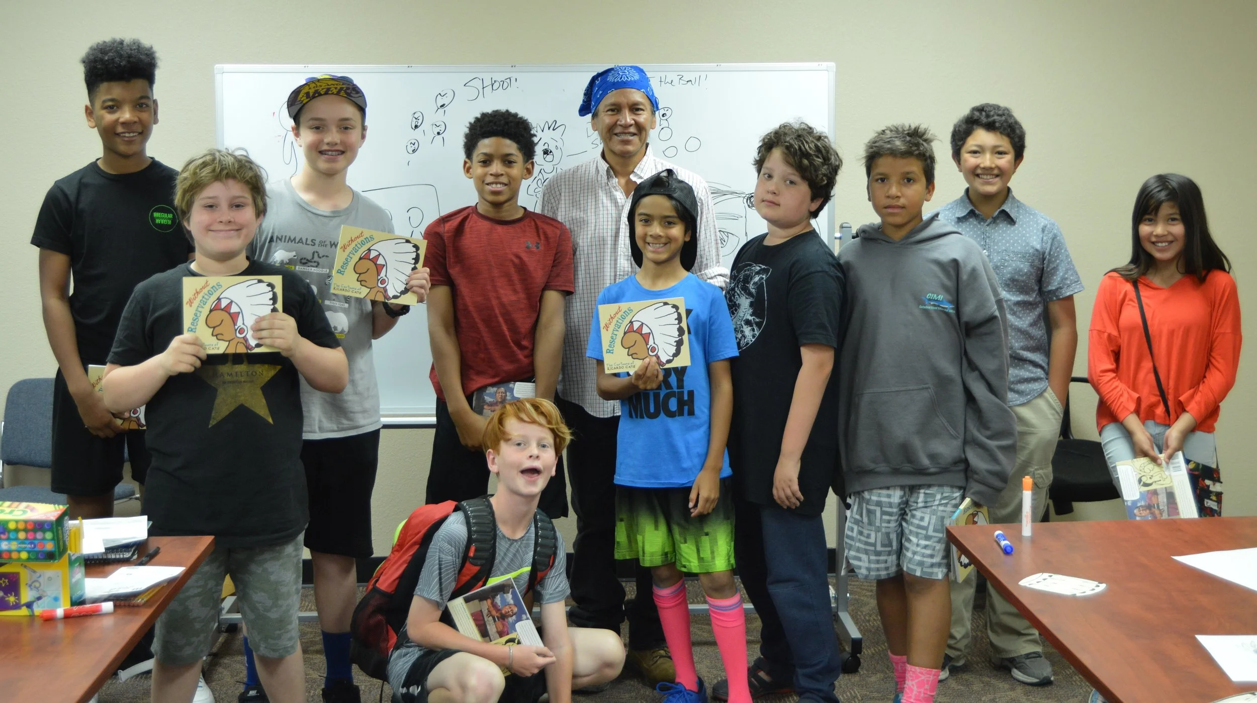 Hummingbirds boys and friends from St. Joseph Mission school with Cartoonist and Activist, Richaro Cate.