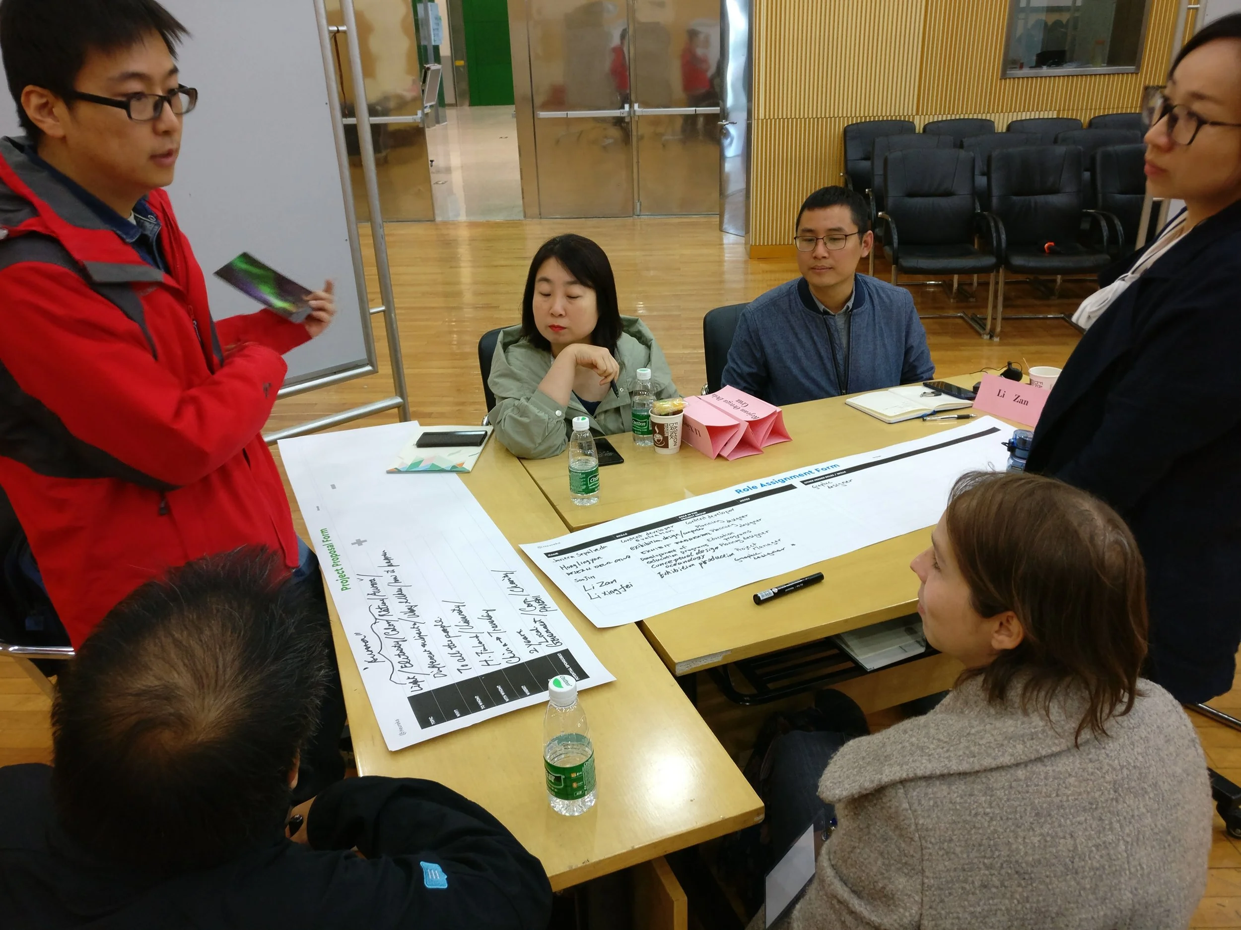 Wei Fei presenting the topic for the exhibition development task for his group.