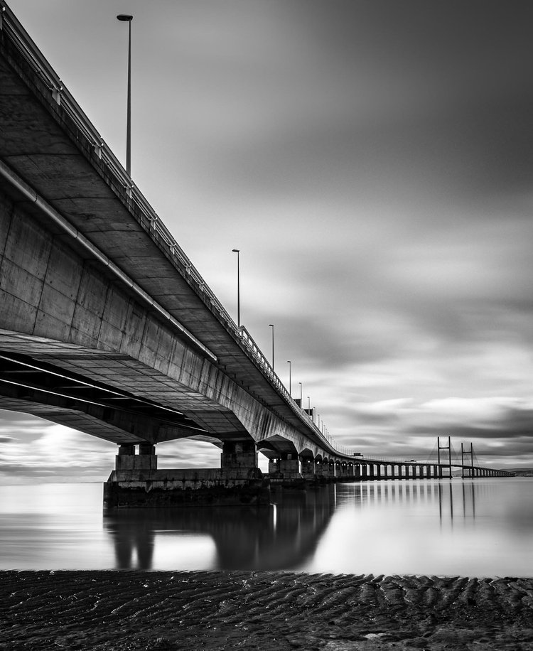 Black and white image of the Prince of Wales Bridge crossing the Severn