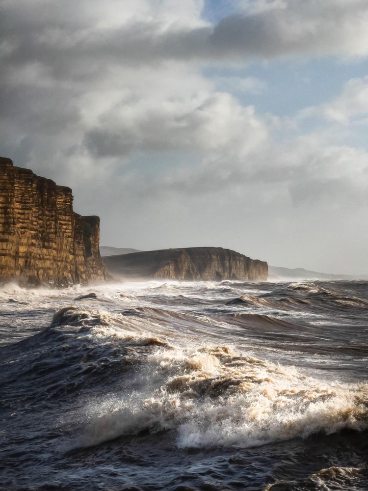 Rough sea at the foot of the cliffs at West Bay, Dorset