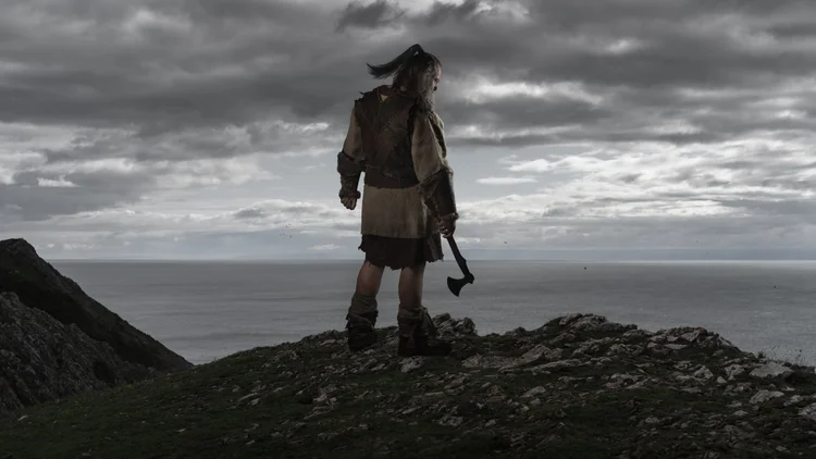 Viking warrior standing on a clifftop looking out to sea
