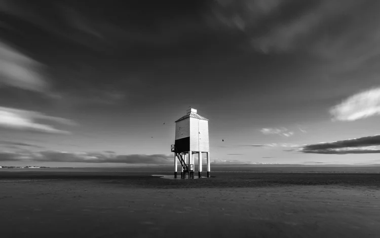 Black and white image of the lighthouse on stilts on the beach at Burnham-on-Sea