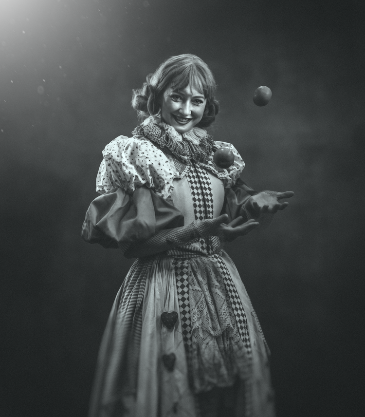Black and white portrait of a woman in a Victorian-style costume