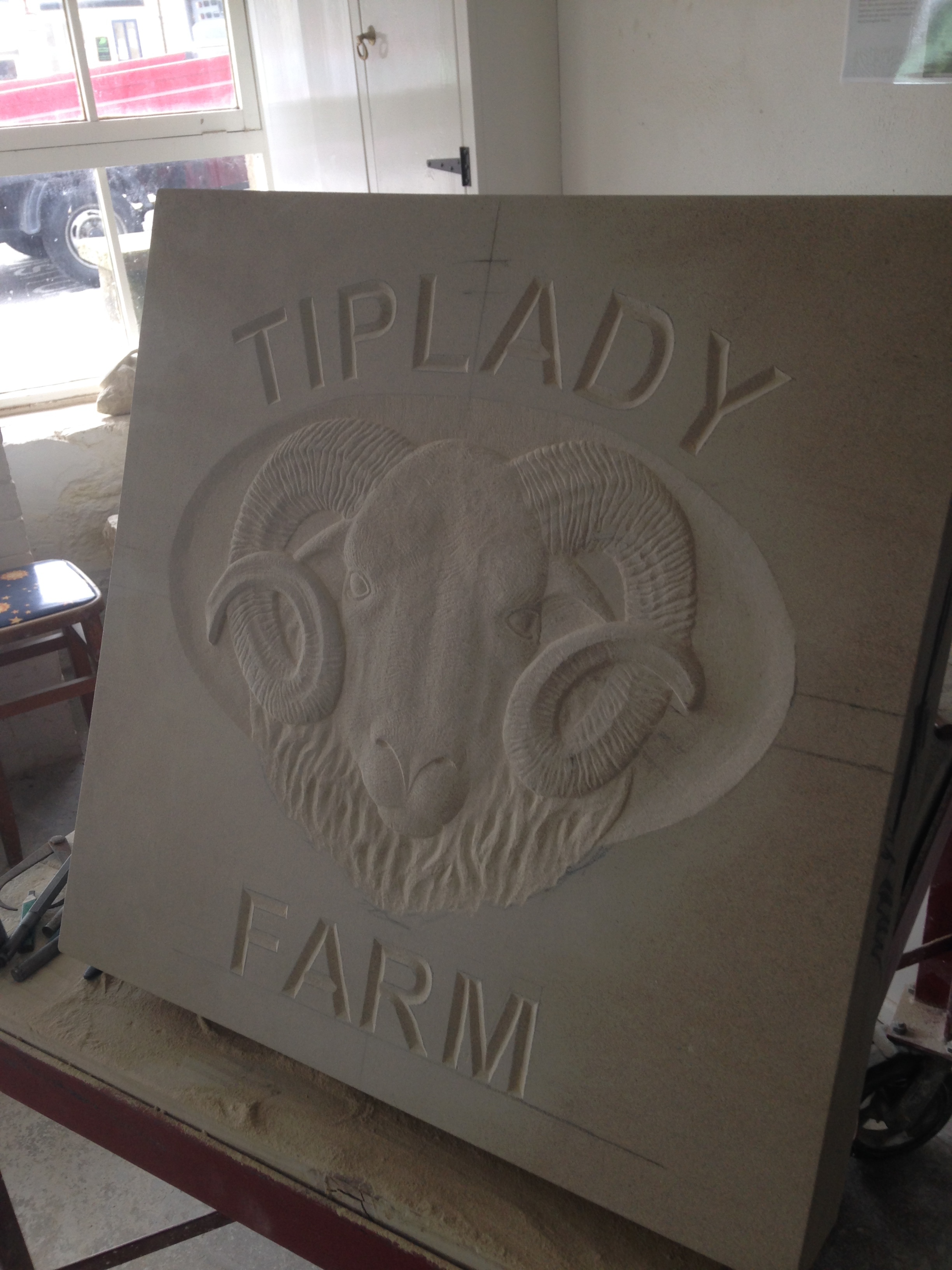 V-cut lettering with Herdwick head - bas relief