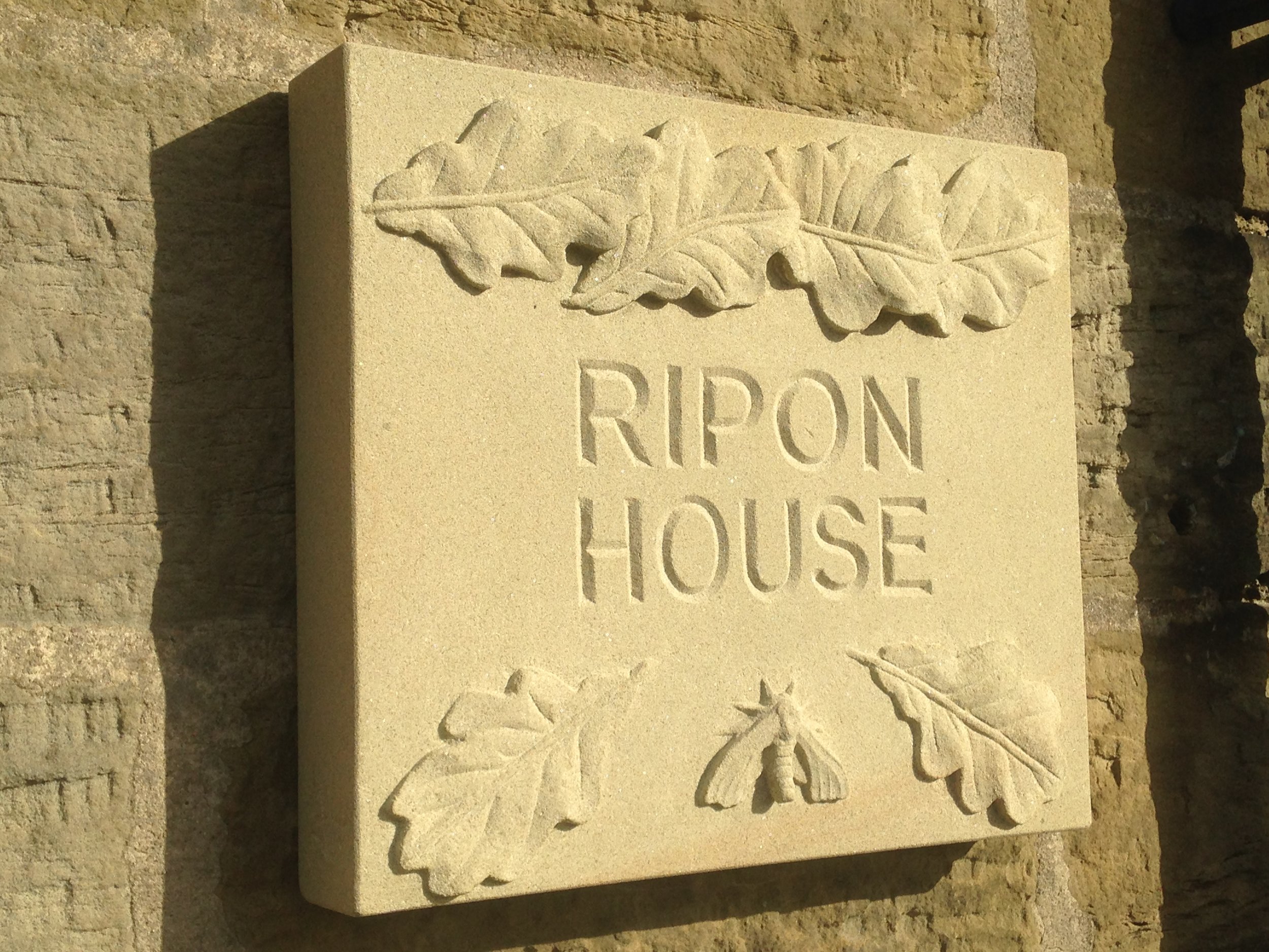 House sign with Oak leaves and Hawk moth