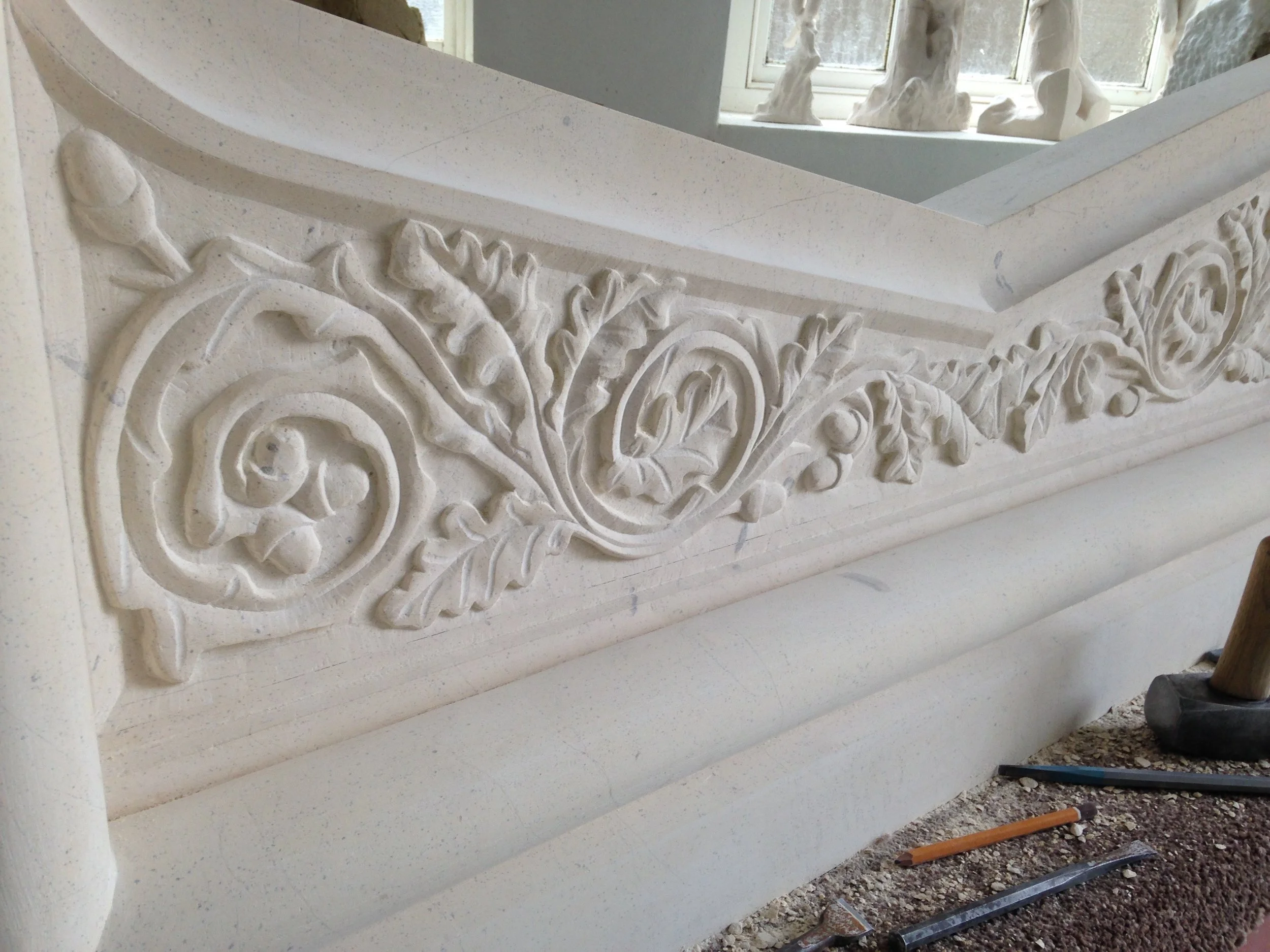 Oak leaf fireplace in Tadcaster limestone