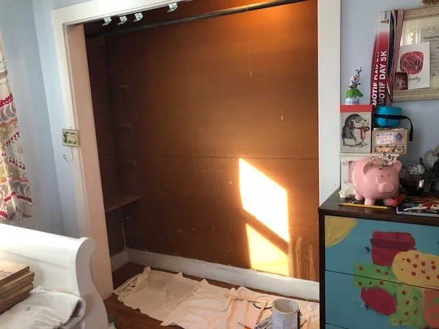empty brown shell of a closet