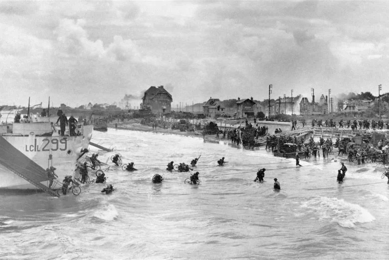Canadian soldiers from 9th Brigade land with their bicycles at Juno Beach in Bernieres-sur-Mer on D-Day