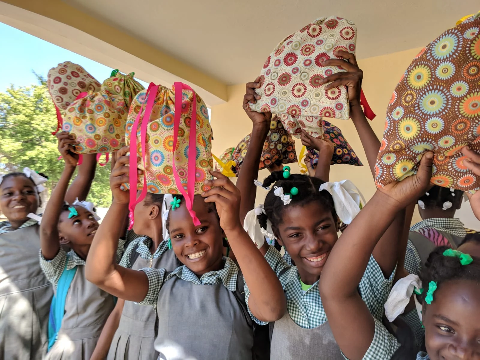 GEM participants happily show off their Days for Girls kits.