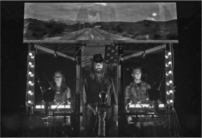 Lorraine Mattox, Ben Beckley, and Brian Greer in Welcome to Nowhere ; Ben on screen above
