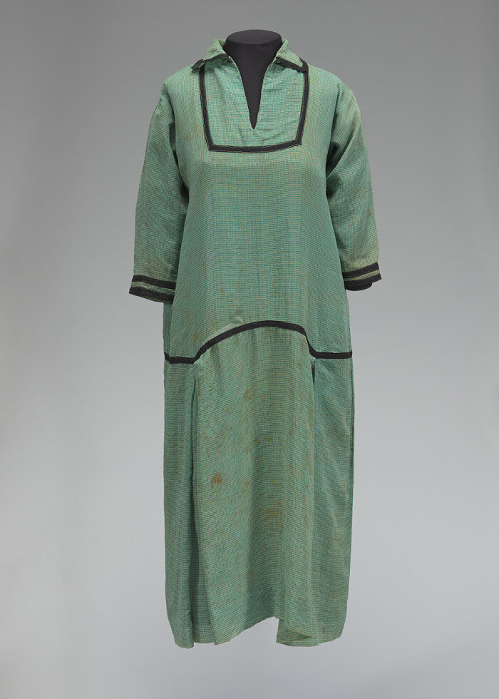 Dress worn by a resident of Rosewood, Florida. Mounted for the National Museum of African American History and Culture.