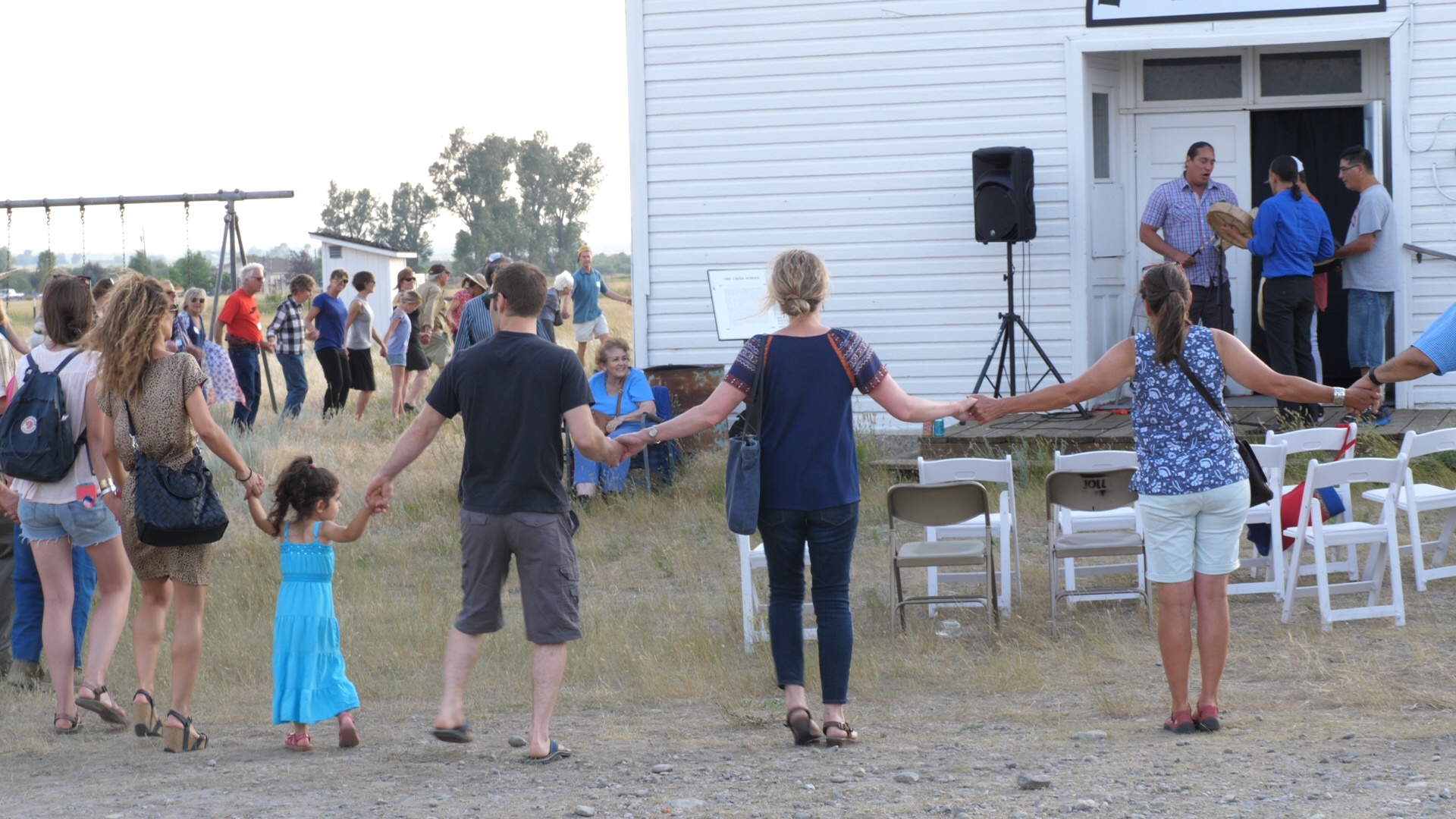 Guests joined hands and did a Native American round dance during the opening of the installation.