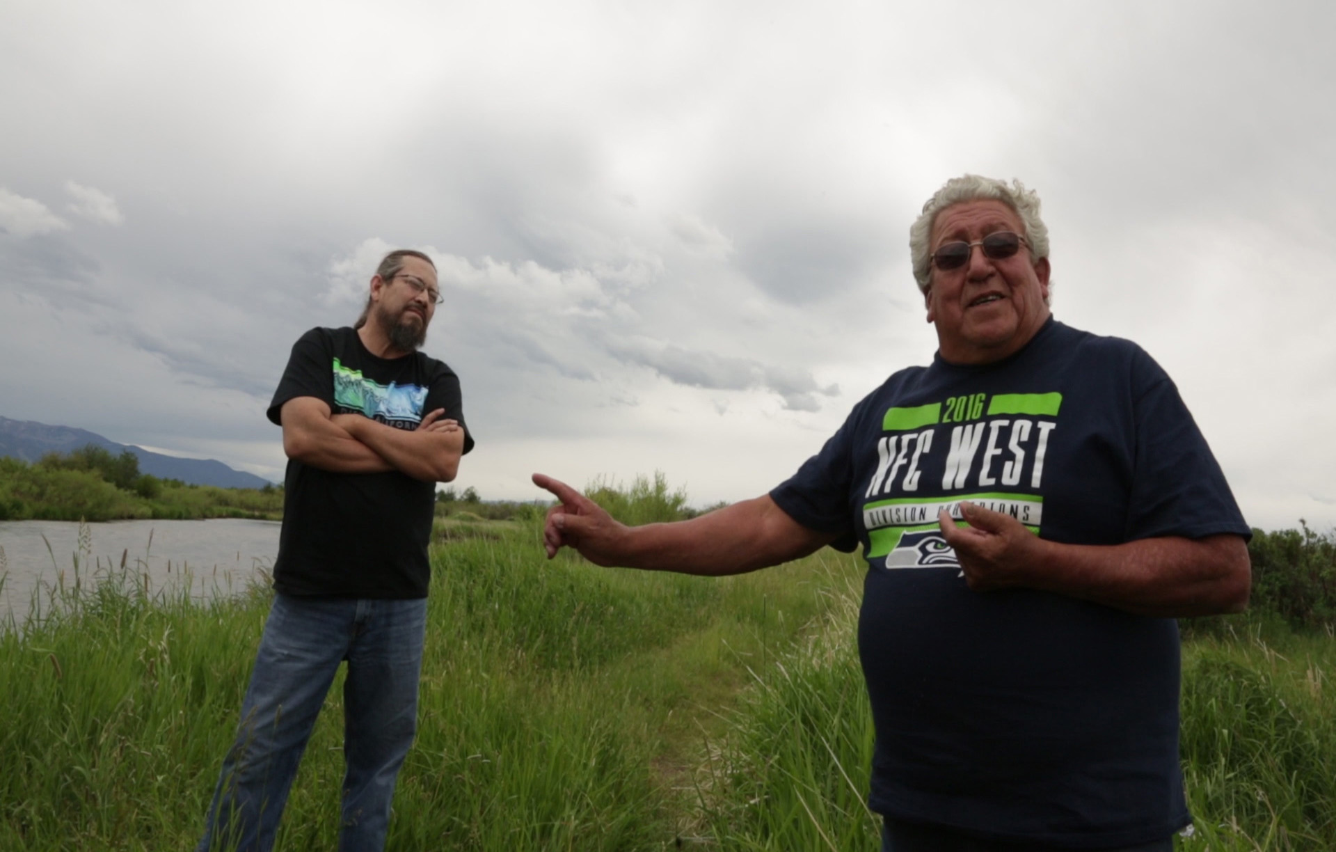  Northern Cheyenne artist Bently Spang (left) and Northern Cheyenne ethnobotanist Linwood Tall Bull (right) discuss the wetlands. 