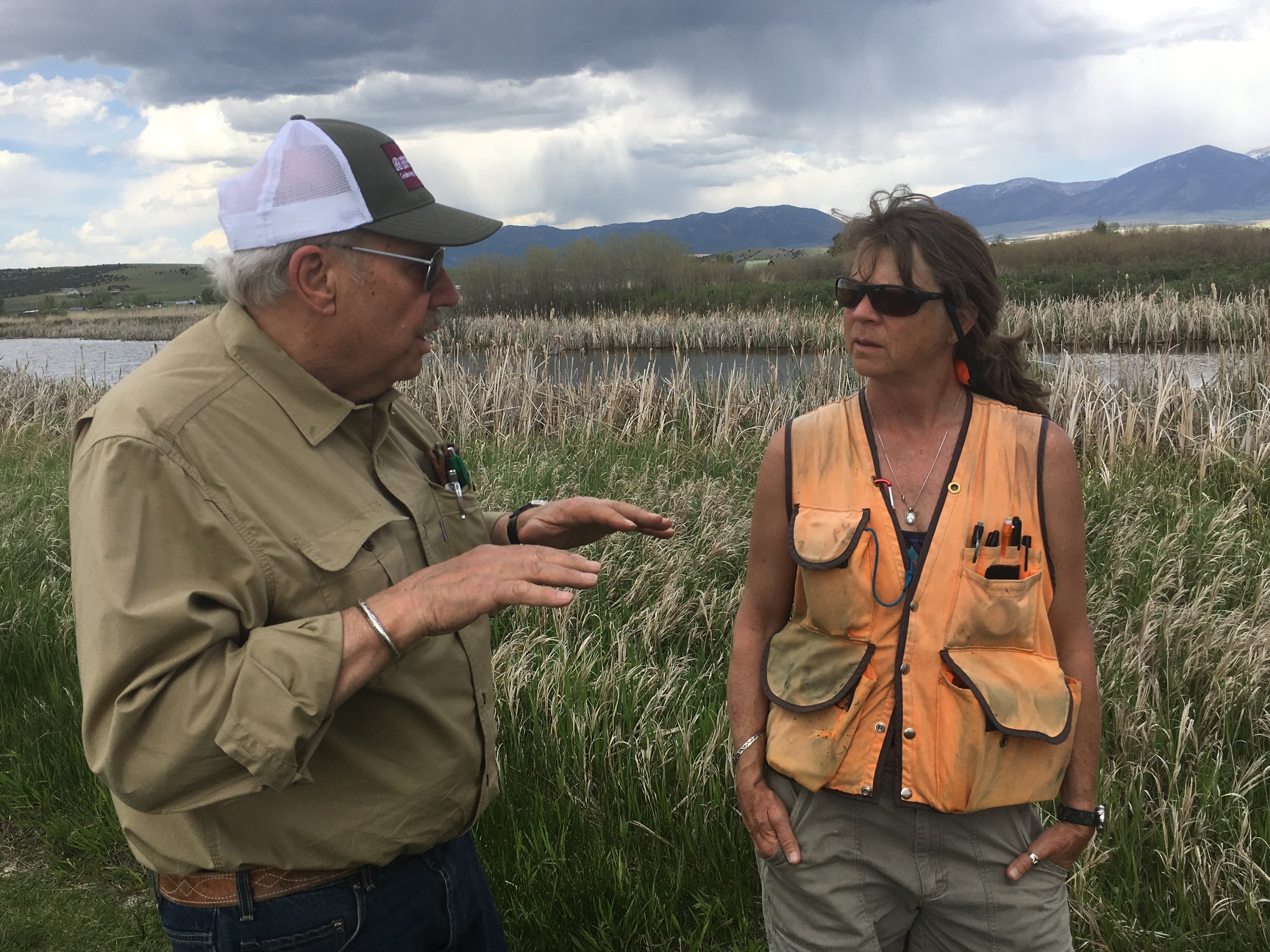  Pheasant Farms owner Tim Crawford (left) and wetlands scientist Lynn Bacon (right) discuss the health of the wetlands. 
