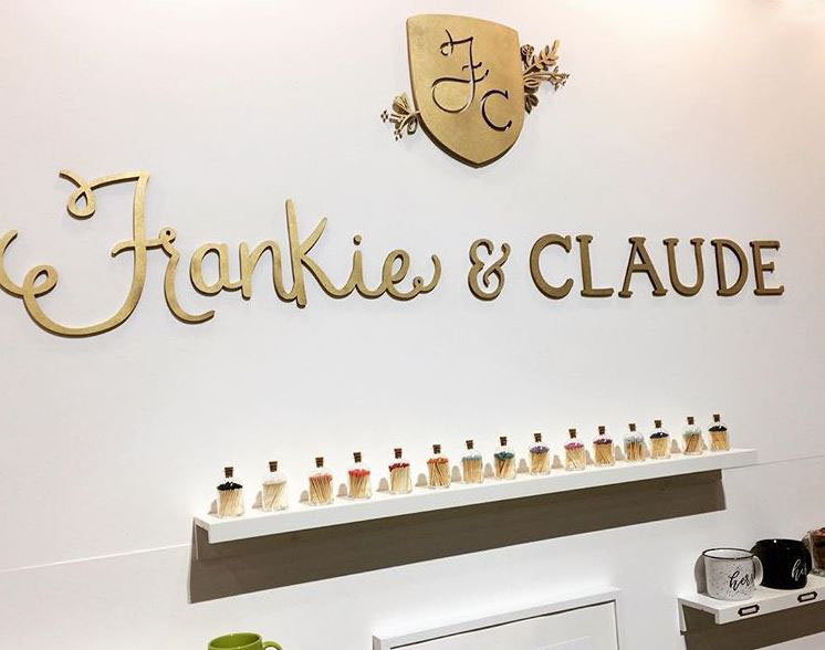 A laser cut logo painted gold for a trade show booth display.