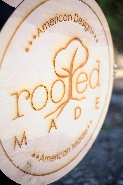 A rustic engraved wood sign, custom made for a small business.