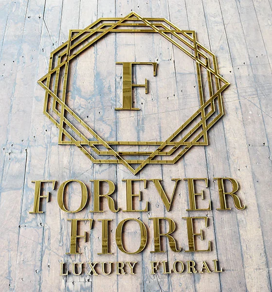 A large mirror business wall sign we made for a luxury florist.
