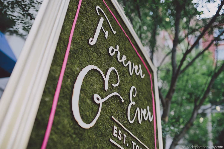 A laser cut hedge sign for moss.