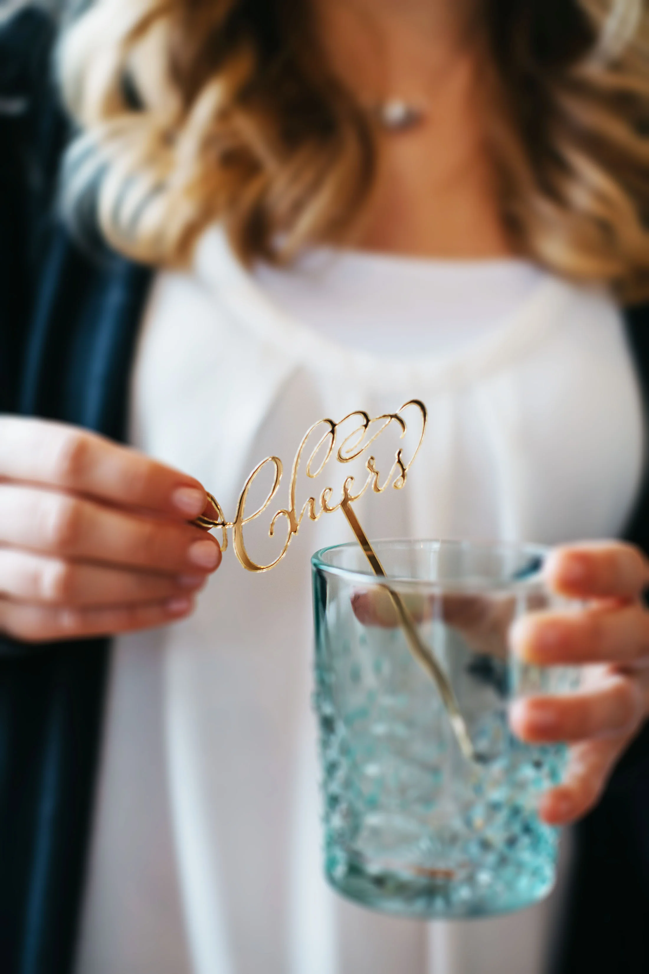 Custom gold mirror cheers drink stirrers we made for a style shoot with Bespoken Weddings .