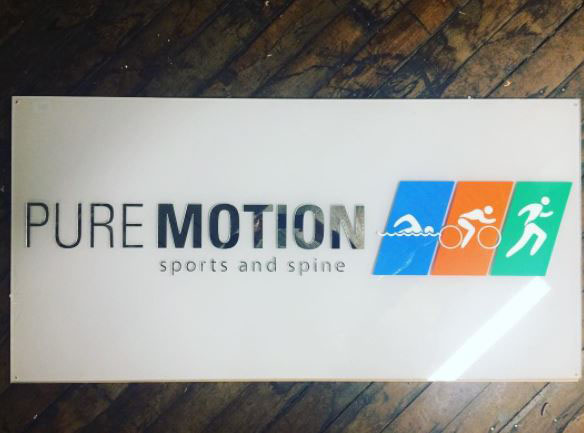 An interior business sign we made for the office of a chiropractor in Greenville, SC…. Pure Motion Sports and Spine. This sign is all acrylic 3D pieces….so the entire sign has dimension (much neater looking than a purely printed acrylic sign).