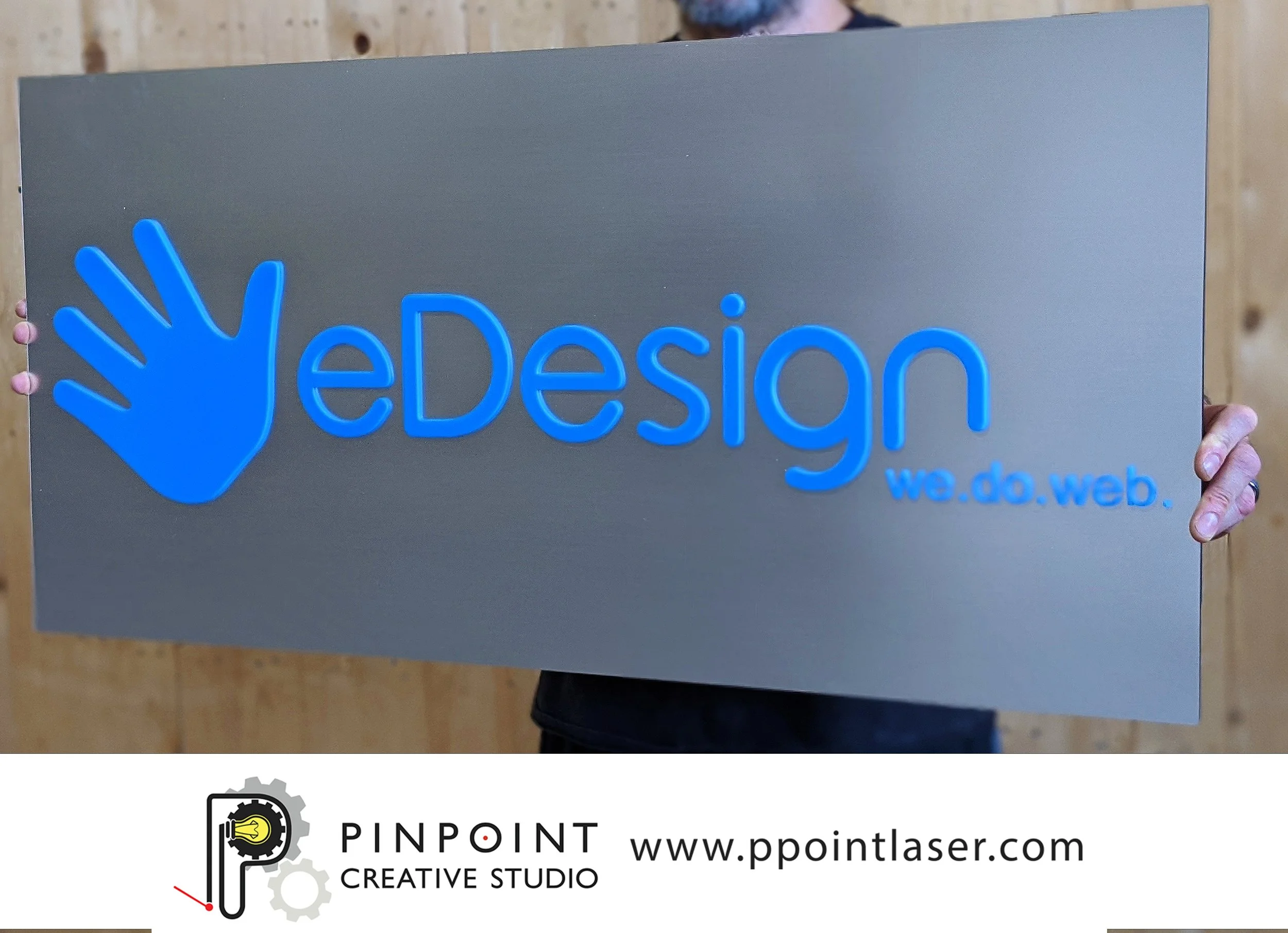 Custom boutique business sign made from blue acrylic mounted to 