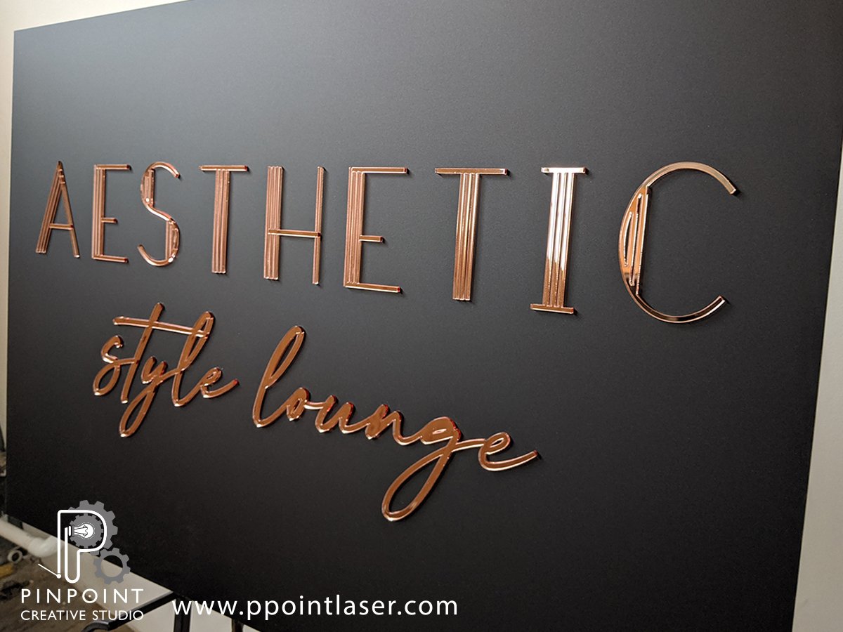 Custom boutique rose gold business sign mounted to matte black acrylic.  Small business wall display — Pinpoint Creative Studio