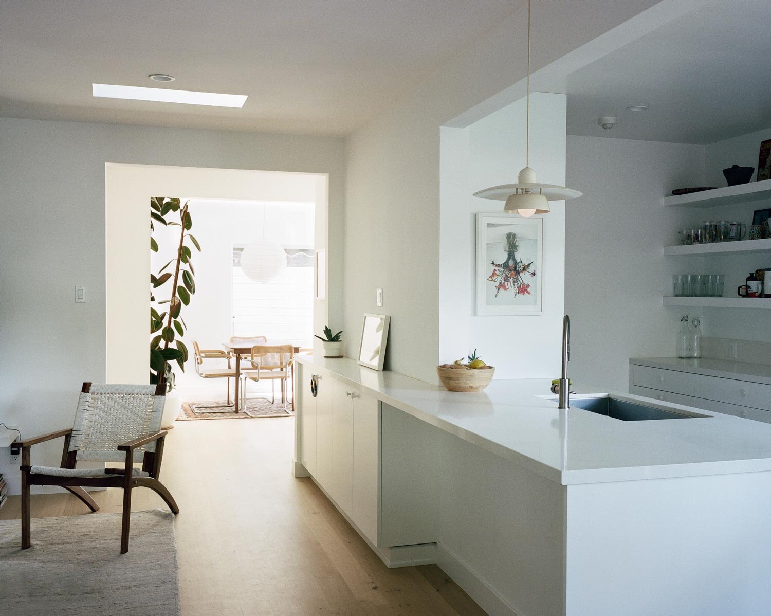 contemporary-white-kitchen-minimal-hardwood-floors-osinoff-general-contractors.jpg