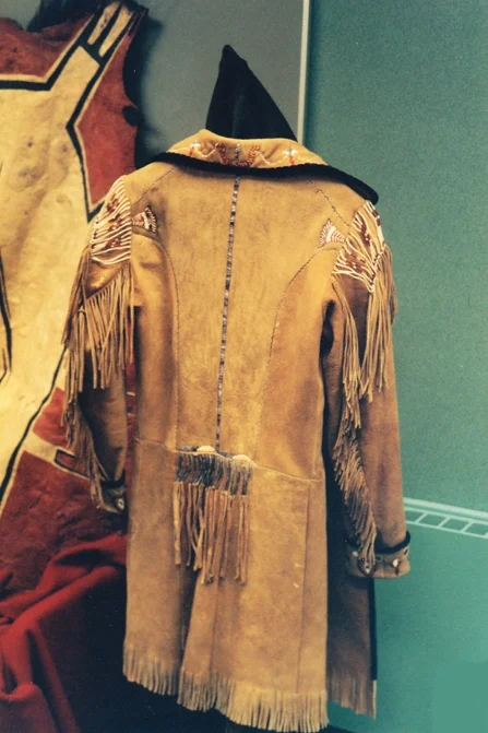 Porcupine quilled frock coat. Brain tanned deer skin. Edged with black velvet and lined with linen