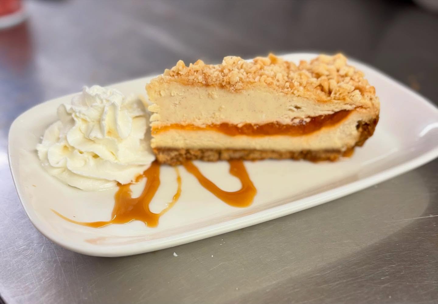Peach &amp; Honey Cheesecake with Graham Cracker Crumble. #tiffanystapandgrill