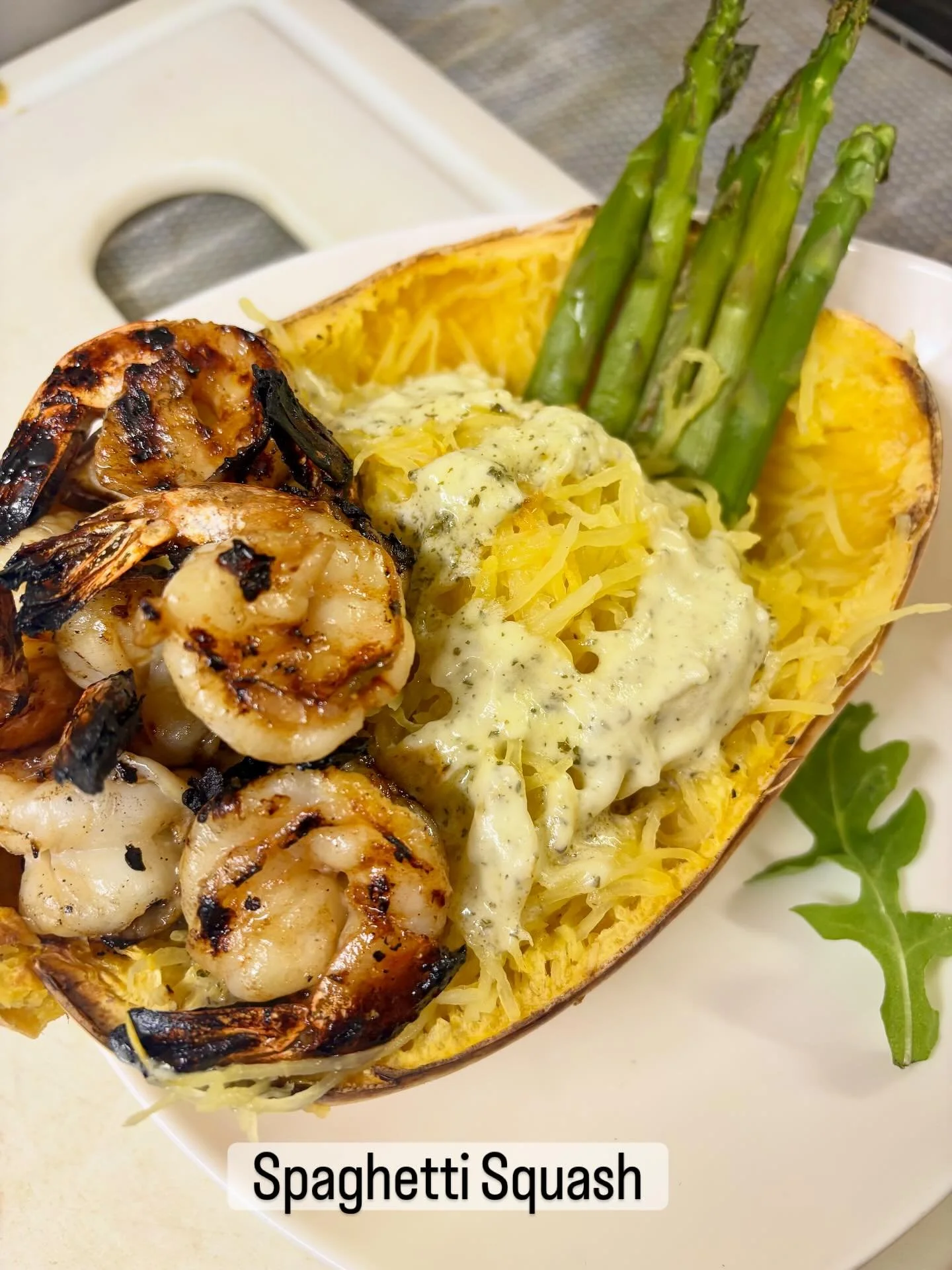 Roasted Spaghetti Squash Stuffed with Steamed Asparagus is Grilled Shrimp. Buerre Monte with Fresh Basil. #tiffanystapandgrill